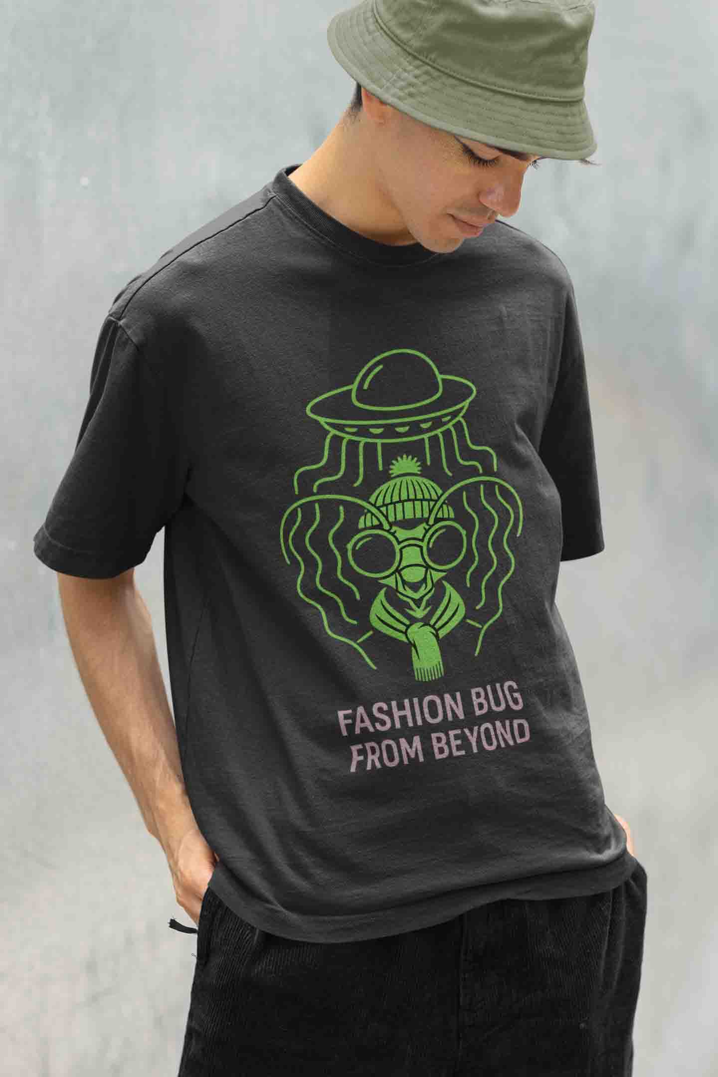 Black oversized tee with green neon alien bug graphic and text "Fashion Bug From Beyond"